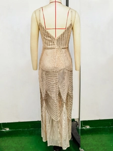 Detailed view of champagne sequin dress with backless design and geometric patterns
