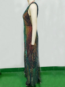 Detail of colorful rainbow gradient sequins and geometric wave pattern on a maxi evening dress