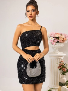 Detail of black sequined dress showing one-shoulder cut and side waist cutout design