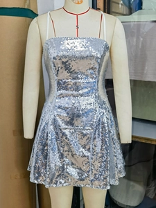 Sleeveless silver sequin party dress with thin straps and shimmering A-line silhouette
