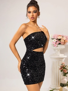 Macro shot of black sequin fabric detail and stylish waist cut-out on mini dress
