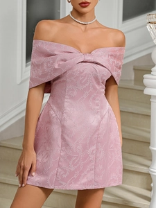 Detail of pink off-shoulder prom dress featuring leaf texture jacquard and bow design