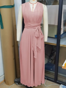 Elegant pink chiffon evening dress with deep V-neck and wrap-around bow waist