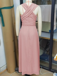 Detailed back view of pink chiffon evening gown with elegant cross lace-up straps