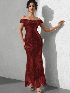 Close-up of sparkling dark red sequins and fine geometric patterns on evening dress