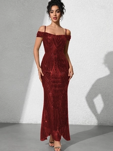 Detail view of the deep red sequin evening dress with radial geometric embroidery