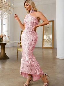 Detailed macro view of pink sequins and elegant mermaid hem on luxury evening dress