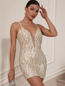 Detail view of the deep V-neckline with skin-tone mesh on the sequined party dress