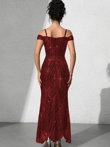 Rear view of burgundy sequin evening gown showing open back and V-shape patterns