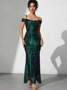 Detail of sequin feather pattern on a slim fit mermaid evening gown with shimmering finish