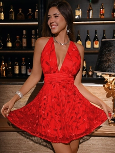Detail view of red halter sequin party dress with embroidery on lightweight mesh fabric