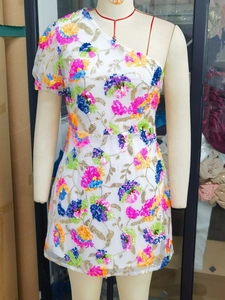 Sexy white one-shoulder bodycon dress featuring colorful sequin flower embroidery