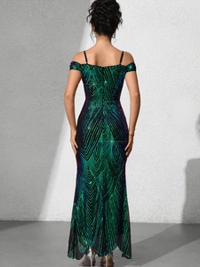 Rear view of backless mermaid evening gown with emerald and purple iridescent sequins