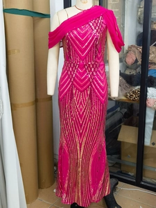 Detail of rose red and gold sequin evening dress with one-shoulder chiffon cape design