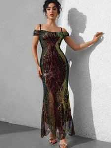 Detail of sequined gradient evening gown featuring off-shoulder straps and fishtail hem