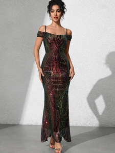 Close-up of rainbow sequin fabric and geometric wave pattern on evening gown