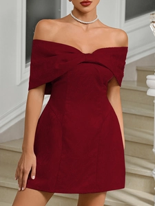 Detail of burgundy off-shoulder mini dress with bow and jacquard fabric texture