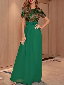 Elegant evening gown featuring green and gold sequins with a flowing chiffon maxi skirt