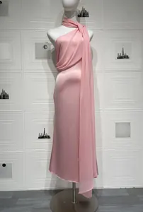 Detail of pink satin halter dress showing the sleek texture and flowing neck ribbon