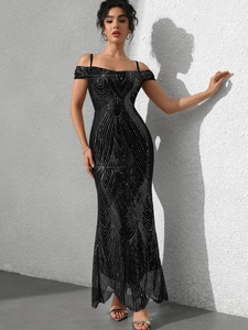 Close-up of elegant black sequin fishtail evening gown with radiant feather pattern