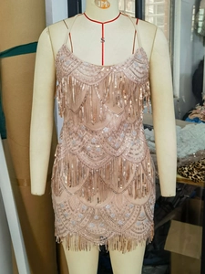 Sparkly rose gold sequin fringe party dress with open back and bohemian tassel layers