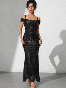 Detail of black sequined evening dress with silver geometric patterns and slim fit