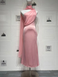 Detail of pink satin halter dress with elegant draped sash and silky texture finish