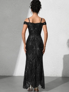 Macro shot of shimmering black sequins with geometric wave pattern on a long evening gown