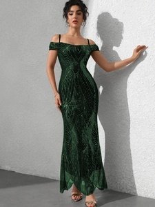 Detailed view of dark green sequin prom dress with geometric patterns and shoulder straps