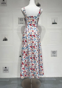 Detail view of floral midi dress showing adjustable straps and elastic waist ruching