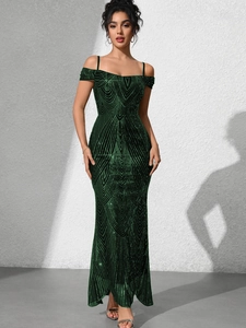 Macro detail of dark green sequins on the body-con evening dress showing geometric patterns