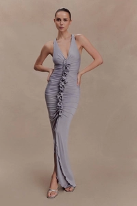 Macro detail of dark grey halter dress featuring ruched vertical folds and slim fit cut