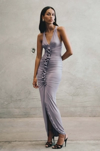 Detailed view of lavender V-neck halter maxi dress with ruched ruffles and high leg slit
