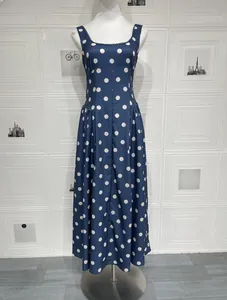 Deep blue U-neck maxi dress featuring white polka dot print and lace trim detailing