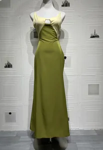 Close-up of sleek avocado green satin dress with hollow-out chest and color-block straps