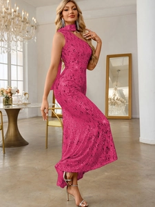 Close-up of sparkling rose red sequins on a one-shoulder mermaid evening dress