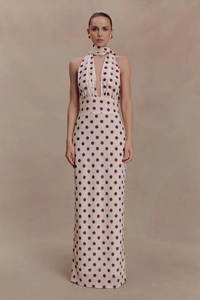 Detailed front view of elegant halter neck maxi dress with large burgundy polka dots