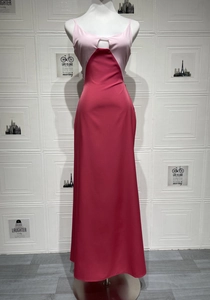 Detail of a two-tone pink satin maxi dress with backless design on a mannequin