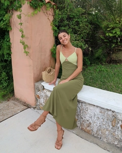 Detail of color-block maxi dress with lime green cutout bodice and olive green skirt