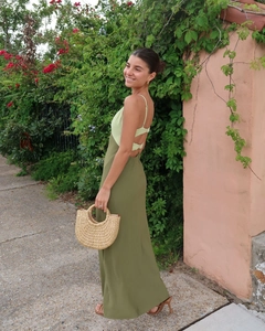 Detail of slim-fit backless maxi dress with thin straps and dual-tone green patchwork