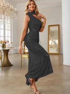 Close-up of black sequined one-shoulder evening gown fabric and texture in luxury room