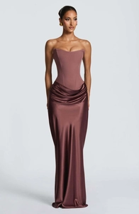 Detailed close-up of corset bodice and pleated satin skirt on this elegant evening gown