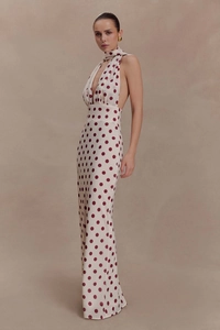 Detail of elegant backless polka dot maxi dress with matching neck scarf detail