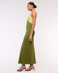 Close-up of the satin patchwork dress showing yellow and olive green fabric contrast