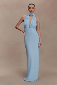Detail of light blue halter neck maxi dress with deep V-neck and elegant wrap scarf