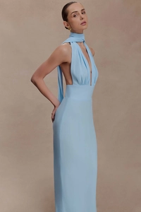 Detail of the elegant light blue backless maxi dress with a stylish neck tie and side view