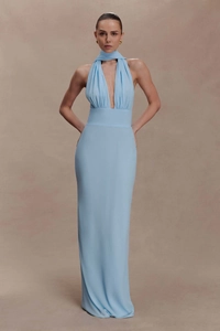 Detail of light blue halter neck maxi dress with waist cinching and draped fabric