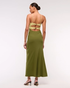Detail of open back design with yellow straps and olive green satin skirt texture