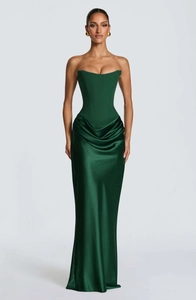 Detail of elegant dark green satin evening gown featuring a corset bodice and draped skirt