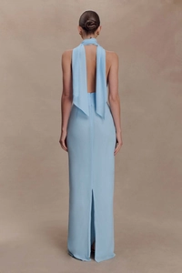 Detail view of light blue halter backless maxi dress with long ribbon and back slit design